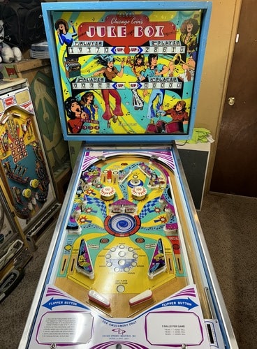 Face-on view of a Chicago Coin Jukebox pinball machine.