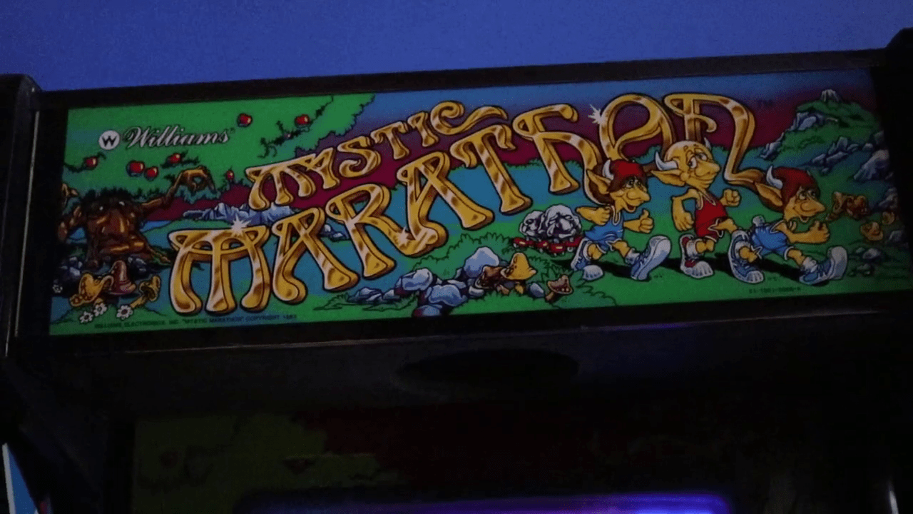 Photo of the marquee for the arcade game Mystic Marathon.