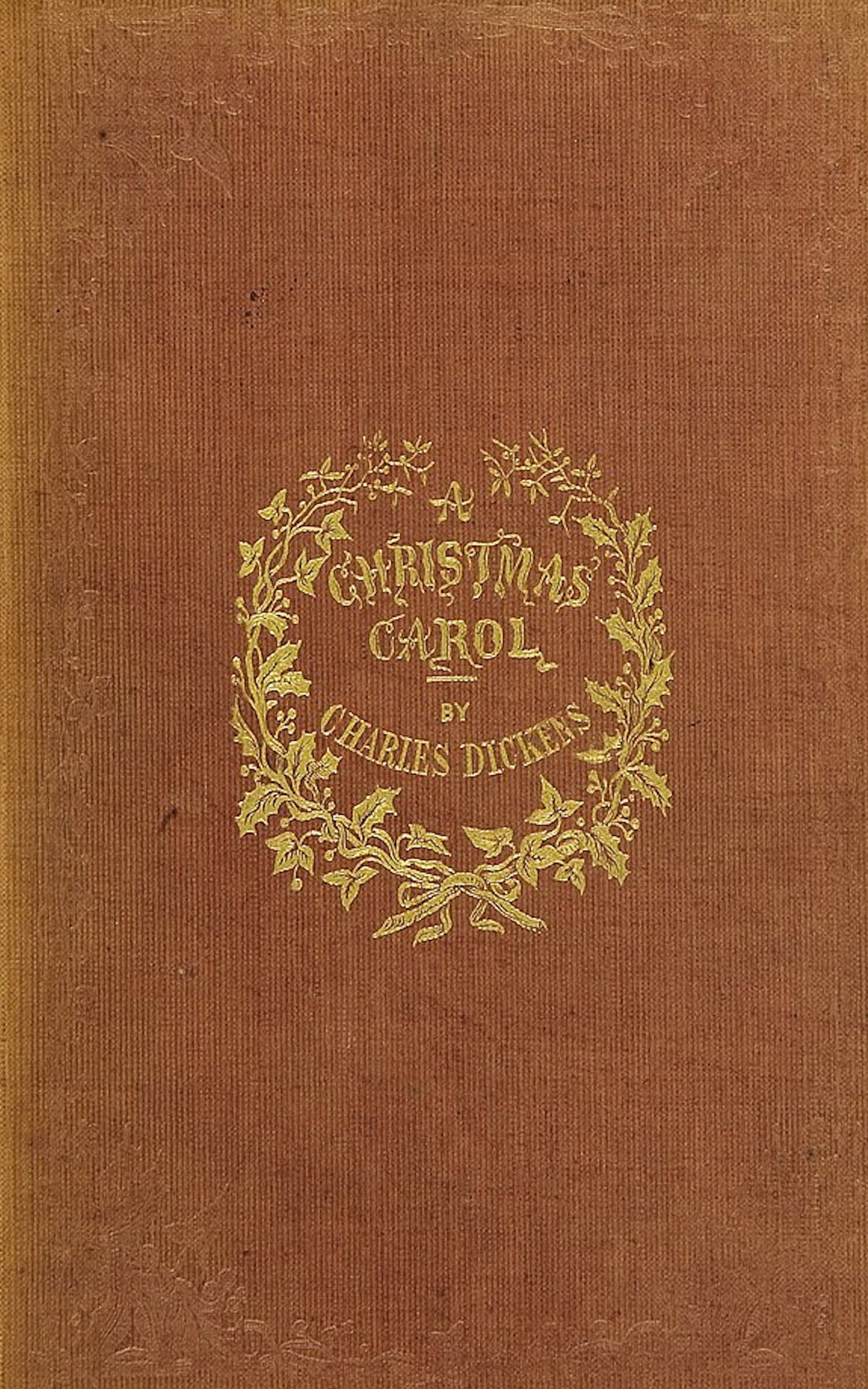 Cover to the first edition of A Christmas Carol, with the title in ornate gold lettering on a brown background