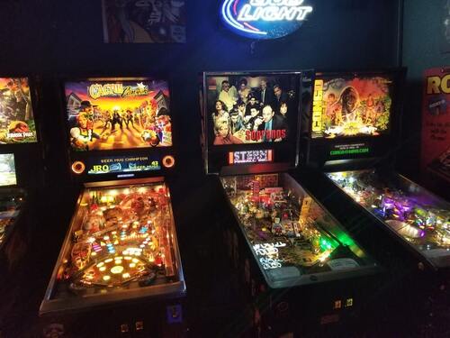 Photo of the pinball machines Cactus Canyon, Sopranos, and Congo. Photo taken at the 1UP bar in Denver, Colorado.