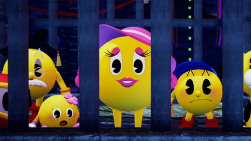 Screenshot of the ‘Pac-Mom’ character from the recent remaster of Pac-Man World, surrounded by other members of the Pac-Man family. While Ms. Pac-Man has a bow on her head, Pac-Mom has a hat. 