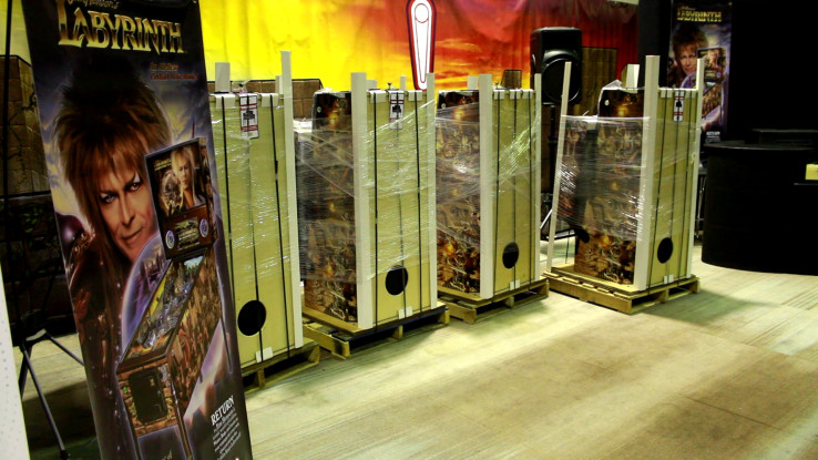 Photo from Houston Arcade Expo 2023 showing cabinets of the pinball game Labyrinth being prepared for setup. 