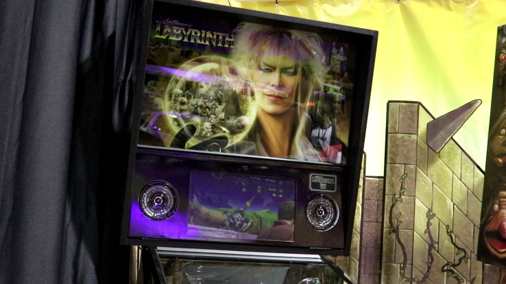 Photograph of the marquee for the Labyrinth pinball machine, with David Bowie’s Goblin King character prominently. 