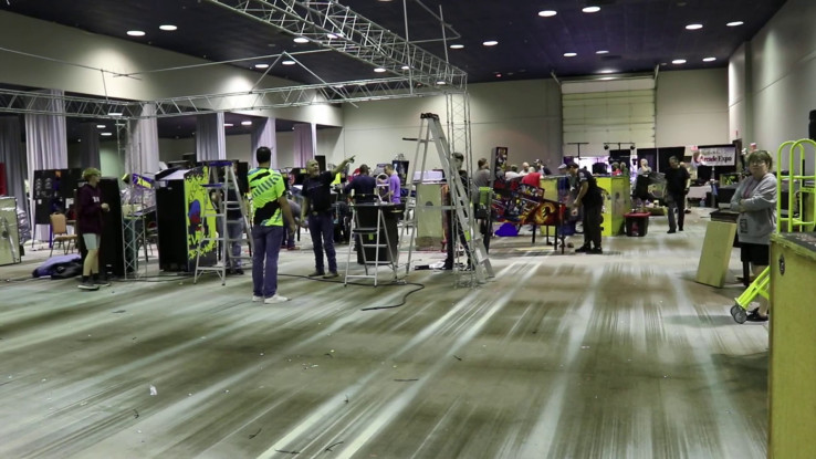 Photo of crews cleaning up at the end of Houston Arcade Expo 2023. 