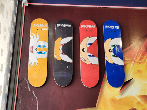 Sonic-themed skateboards hanging on a wall at the Sonic Speed Cafe in Katy, TX. From left to right: Tails, Shadow, Knuckles, and Sonic. 