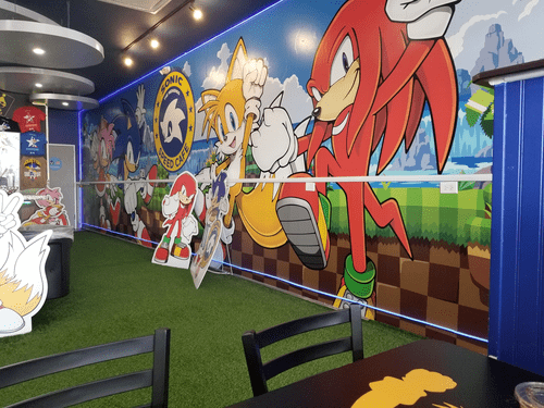 Wall with a mural of Sonic characters.