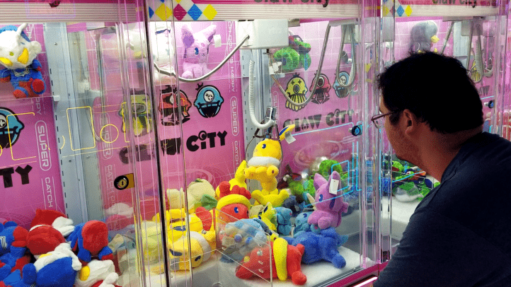 AT Gonzalez tries his hand at a ‘UFO machine’ in Claw City. 